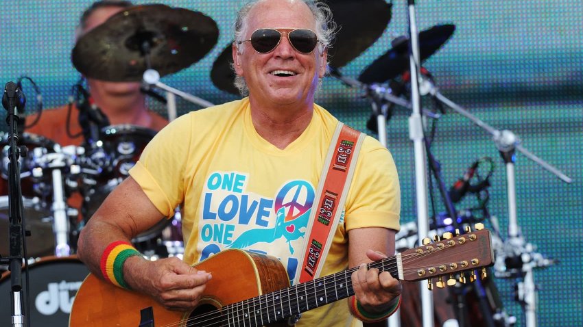Musician Jimmy Buffett performs onstage at Jimmy Buffett & Friends: Live from the Gulf Coast, a concert presented by CMT at on the beach on July 11, 2010 in Gulf Shores, Alabama.