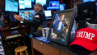 Traders work on the New York Stock Exchange floor on Dec. 18, 2024.