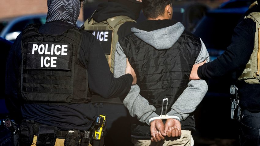 Immigration and Customs Enforcement agents detain a man after conducting a raid at the Cedar Run apartment complex in Denver, Colorado, U.S., Feb. 5, 2025. 