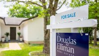 A for sale sign is displayed near a home on April 24, 2025 in Austin, Texas.
