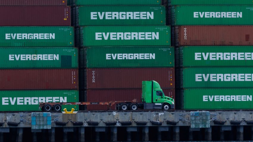 A container truck and shipping containers are shown at the Port of Los Angeles, in San Pedro California, U.S., May 13, 2025.