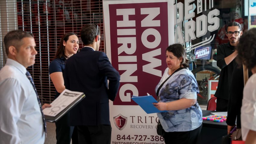 Kiaraliz Irizarry (L) recruits people for jobs at Triton Recovery during the Mega JobNewsUSA South Florida Job Fair held in the Amerant Bank Arena on April 30, 2025 in Sunrise, Florida.