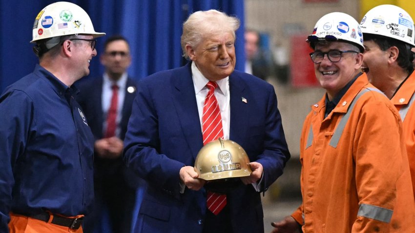 US President Donald Trump receives a gold helmet with his name on it during a visit to US Steel – Irvin Works in West Mifflin, Pennsylvania, May 30, 2025, to mark the ‘partnership’ between Nippon Steel and US Steel.