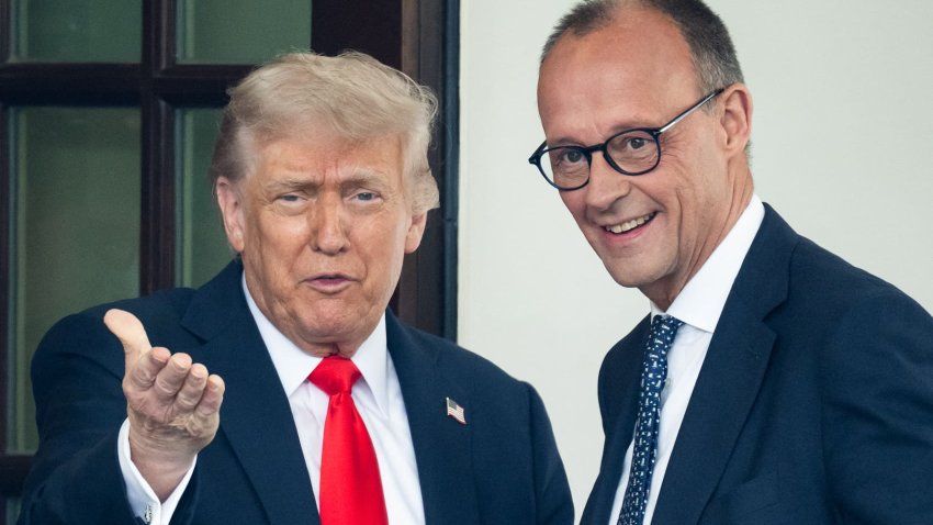 President Donald Trump gestures toward the press as he greets German Chancellor Friedrich Merz upon arrival at the West Wing of the White House in Washington, DC, on June 5, 2025.