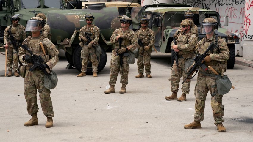 California National Guard personnel stand outside the Edward R. Roybal federal building after their deployment by U.S. President Donald Trump, in response to protests against immigration sweeps, in Los Angeles, California, U.S. June 8, 2025.