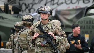 Members of the California National Guard stand watch outside the Edward R. Roybal Federal Building in Los Angeles, as protests continue in response to federal immigration operations, June 10, 2025.