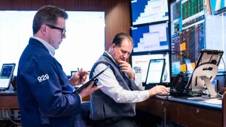 Traders work on the floor of the New York Stock Exchange on June 10, 2025.