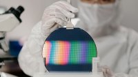Chip engineer handling a wafer. Compared to Nvidia’s export-restricted chips, the performance gap between Huawei and the H20 is less than a full generation,” said Dylan Patel, founder, CEO and chief analyst of SemiAnalysis.