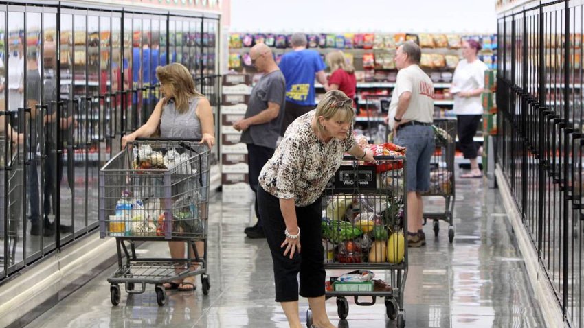 Shoppers browse the frozen food cases at WinCo.