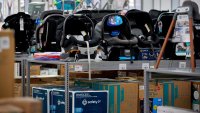 Baby car seat carriers for sale at a Walmart store in Secaucus, New Jersey, US, on Tuesday, March 5, 2024.