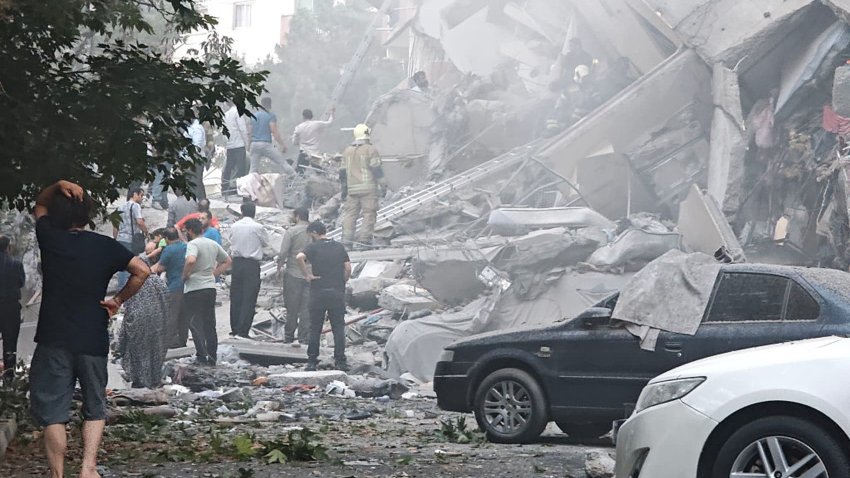People look over damage to buildings in Nobonyad Square following Israeli airstrikes on June 13, 2025 in Tehran, Iran.