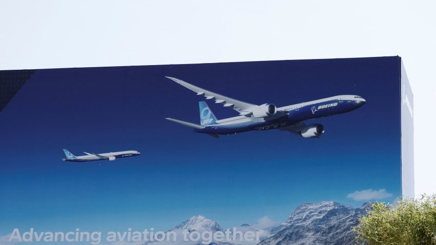 A poster showing Boeing 777X and Boeing 787 airplanes is seen before the opening of the 55th International Paris Airshow at Le Bourget Airport near Paris on June 13, 2025.