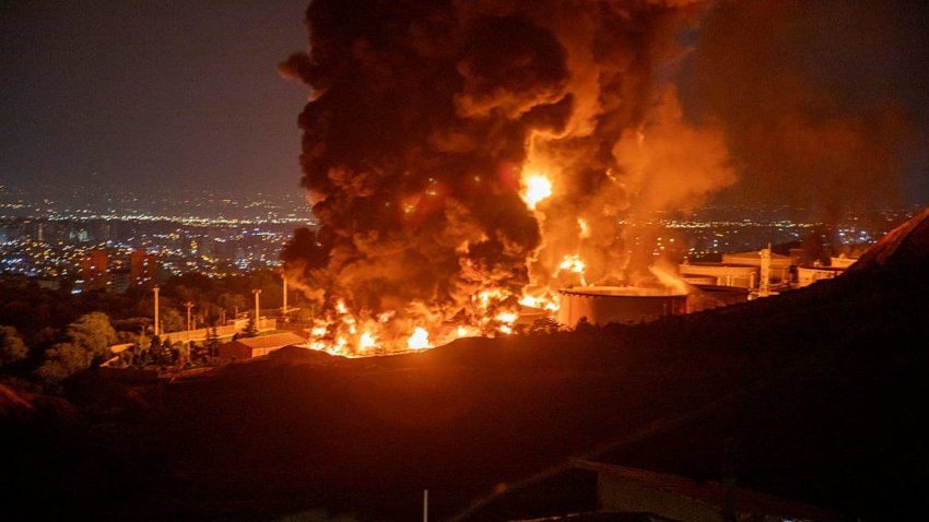 Fire and smoke rise into the sky after an Israeli attack on the Shahran oil depot on June 15, 2025 in Tehran, Iran.