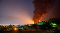 Fire and smoke rise into the sky after an Israeli attack on the Shahran oil depot on June 15, 2025 in Tehran, Iran.