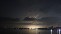 Trails of Iranian ballistic missiles light up the night sky as seen from Gaza City during renewed missile strikes launched by Iran in retaliation against Israel on June 15, 2025.