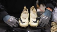 A worker sorts incoming clothing items at Artikel2’s sorting center in Stockholm on April 10, 2025.