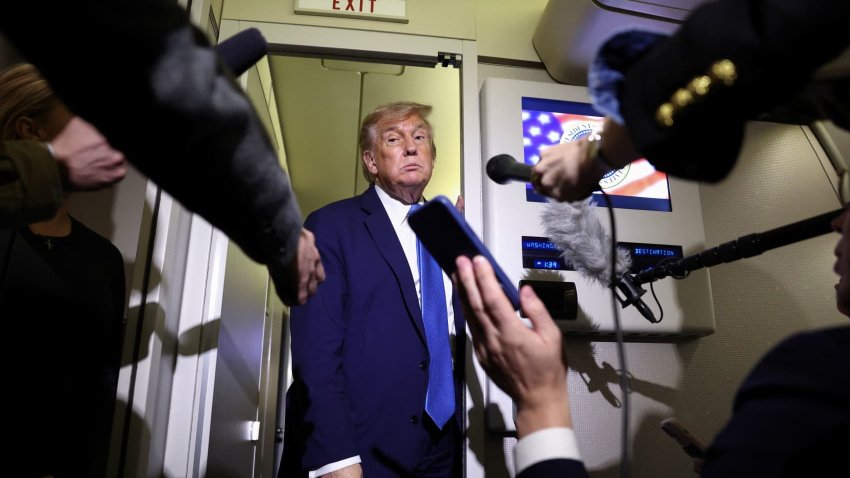 U.S. President Donald Trump speaks to reporters aboard Air Force One after departing early from the the G7 summit in Canada to return to Washington, June 17, 2025.
