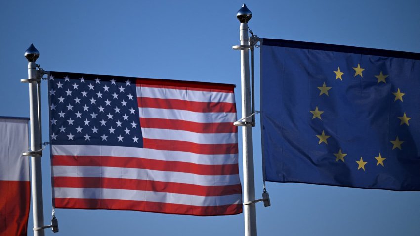 The EU and US flags flutter next to the military hub for Ukraine, in Jasionka, south-east Poland on March 6, 2025.
