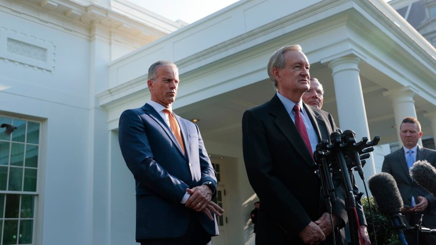 Senate Majority Leader John Thune (R-SD), left, listens to Sen. Mike Crapo (R-ID), center, chair of the Senate Finance Committee, speak to reporters outside of the West Wing of the White House on June 4, 2025.