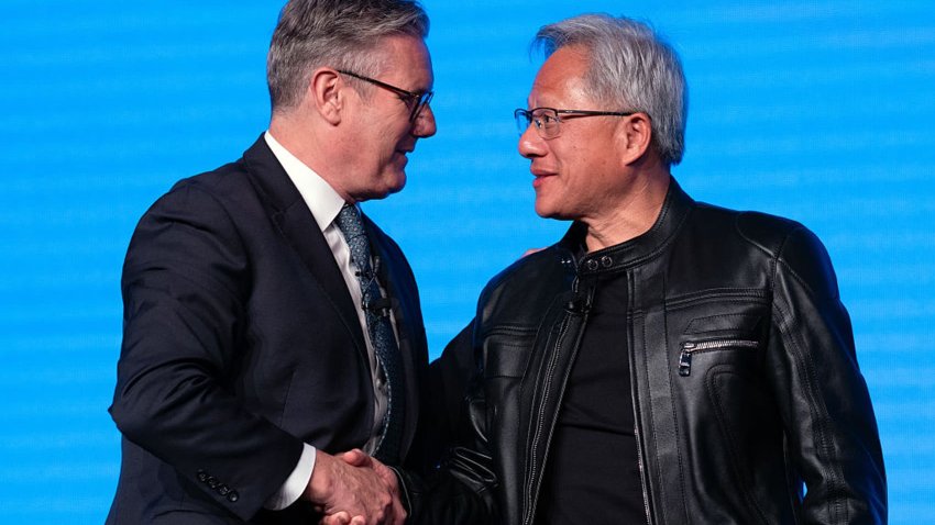 British Prime Minister Keir Starmer shakes hands with Nvidia CEO Jensen Huang after a panel discussion at London Tech Week on June 9, 2025 in London, England.