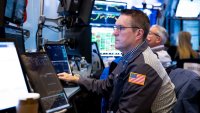 Traders work at the New York Stock Exchange on June 18, 2025.