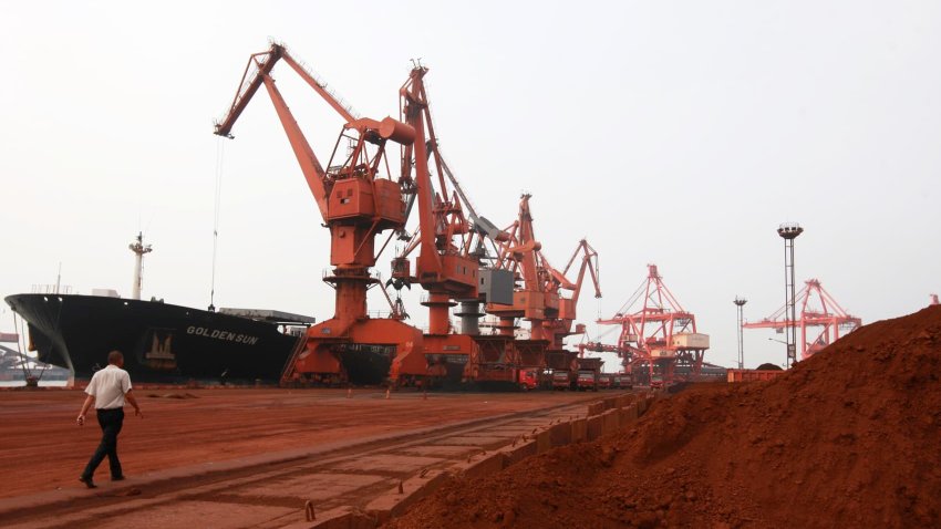 Bulldozer scoop soil containing various rare earth to be loaded on to a ship at a port in Lianyungang, east China’s Jiangsu province on September 5, 2010, for export to Japan.