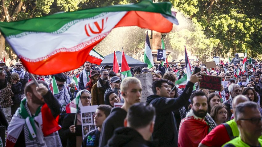 Protesters in support of Iran and Palestinians in Gaza hold flags and placards during a demonstration against the actions of Israel and the United States in Sydney on June 22, 2025.