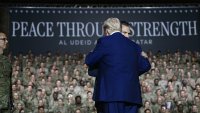 US President Donald Trump (L) greets Secretary of Defense Pete Hegseth as he arrives to address troops at the Al-Udeid air base southwest of Doha on May 15, 2025.