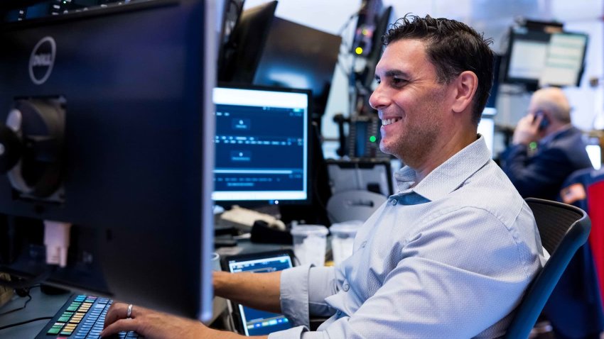 Traders work at the New York Stock Exchange on June 25, 2025.