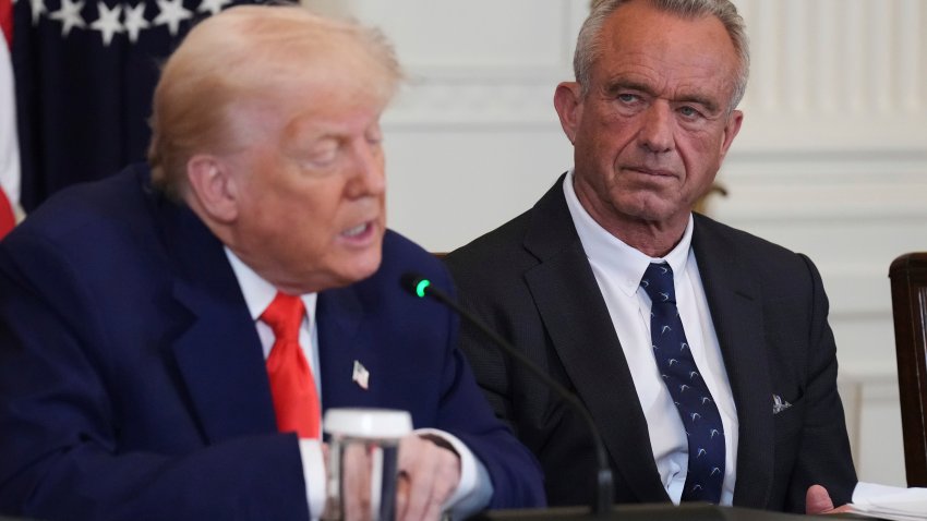President Donald Trump, left, speaks as Health and Human Services Secretary Robert F. Kennedy Jr. listens during a Make America Healthy Again (MAHA) Commission Event in the East Room of the White House, Thursday, May 22, 2025, in Washington.