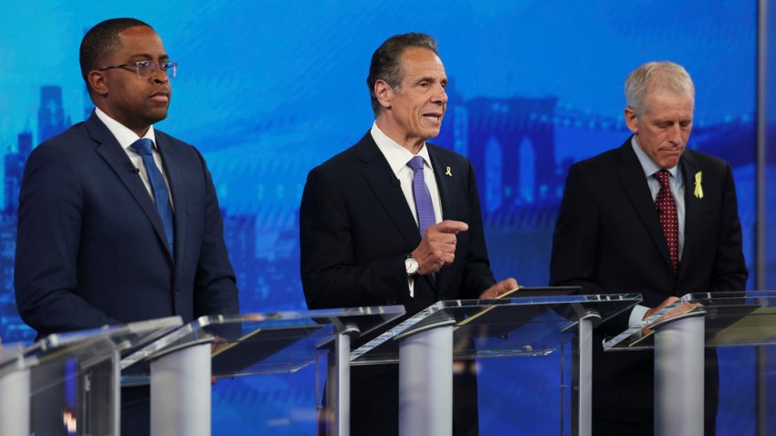Andrew Cuomo, center, speaks during a Democratic mayoral primary debate as Zellnor Myrie, left, and Whitney Tilson look on, Wednesday, June 4, 2025, in New York. (AP Photo/Yuki Iwamura, Pool)