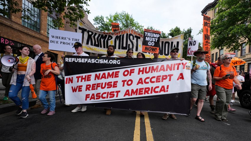 Demonstrators march during a protest taking place on the day of a military parade commemorating the Army's 250th anniversary, coinciding with President Donald Trump's 79th birthday, Saturday, June 14, 2025, in Washington.