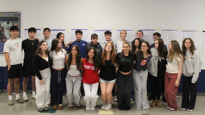 Twin students pose for a group photo