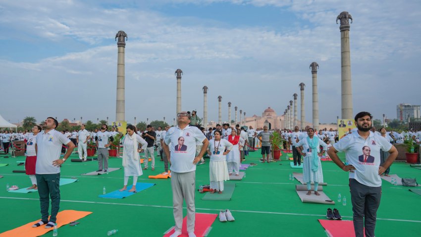 Indians perform yoga