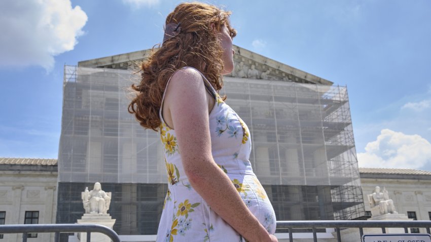 FILE - Mairelise Robinson, a pregnant U.S. citizen, attends a protest in support of birthright citizenship, outside of the Supreme Court in Washington, May 15, 2025.