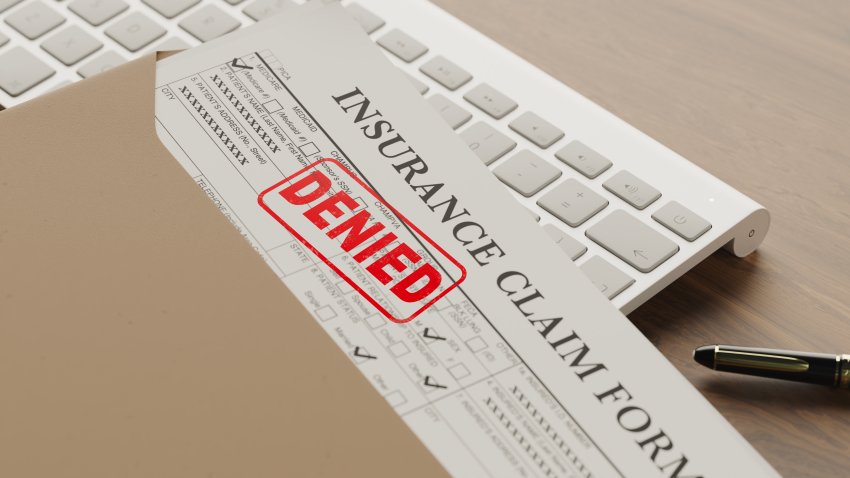 denied health insurance form on the table