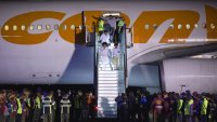 Deported individuals from the US arrive on a flight at Simon Bolivar International Airport (CCS) in Maiquetia, Vargas state, Venezuela, early on Monday, March 24, 2025