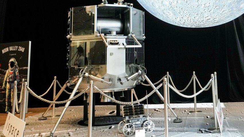 Models of the lunar lander Resilience (centre, L) and the lunar rover Tenacious (centre, R) operated by Japanese private company ispace are displayed at the Moon landing event venue in Tokyo on June 6, 2025. Japan’s hopes of achieving its first soft touchdown on the Moon by a private company were dashed on June 6 when the mission was aborted after an assumed crash-landing, the startup said.
