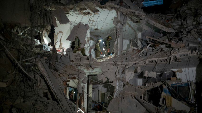 Israeli rescue forces in a building damaged by an Iranian ballistic missile attack in Ramat Gan, Israel, on Friday, June 13, 2025. Iran fired hundreds of ballistic missiles against Israel following an unprecedented direct attack on its nuclear facilities, ramping up a conflict between sworn enemies that threatens to engulf the Middle East and disrupt global oil supplies.