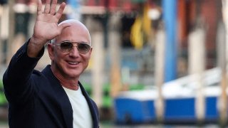 Jeff Bezos gestures as he leaves Aman Venice hotel, ahead of their expected wedding, in Venice, Italy, June 25, 2025.