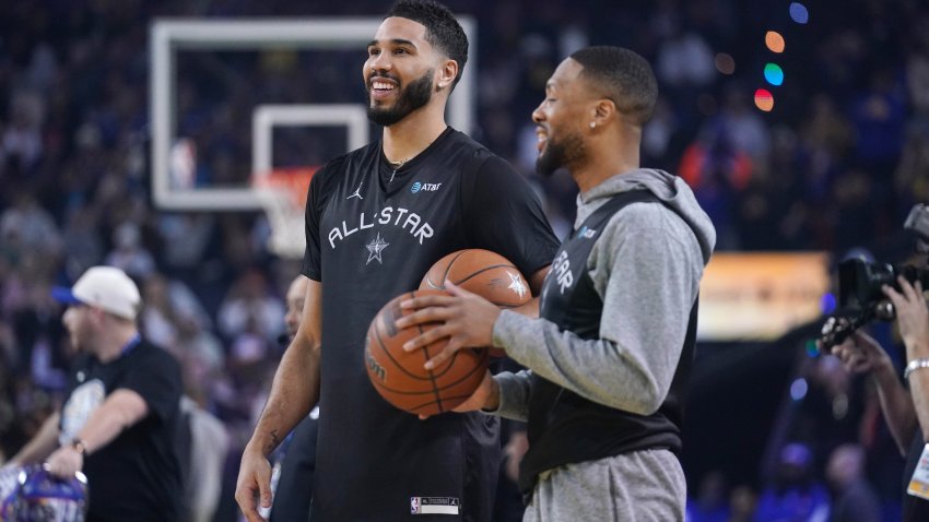 Feb 15, 2025; Oakland, CA, USA; Shaq’s OGs forward Jayson Tatum (0) of the Boston Celtics interacts with guard Damian Lillard (0) of the Milwaukee Bucks during the NBA All Star-Practice at Oracle Arena. Mandatory Credit: Cary Edmondson-Imagn Images