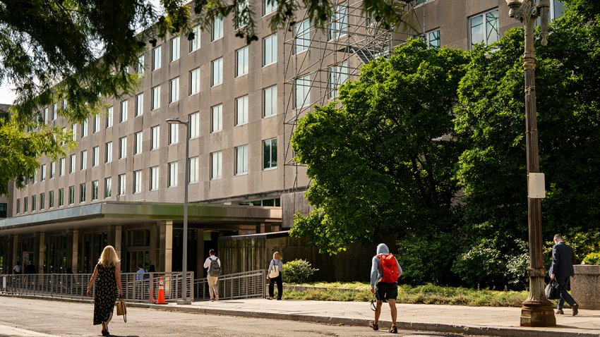 Workers arrive at the US State Department in Washington, DC, US, on Friday, July 11, 2025. The State Department announced plans to lay off some US-based diplomats and other employees, after the Supreme Court ruled that the Trump administration can go ahead with plans to slash the size of the federal workforce.