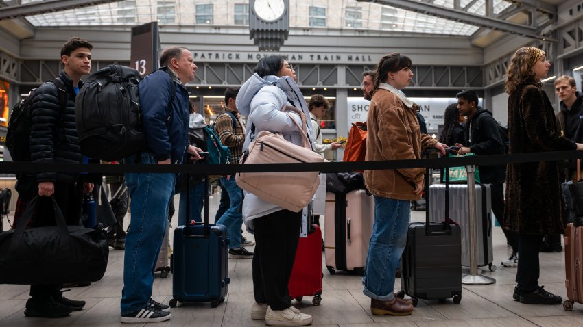 NEW YORK CITY – NOVEMBER 26: People move through the Moynihan Train Hall in Manhattan on November 26, 2025, in New York City. A record number of Americans are expected to travel this Thanksgiving holiday, with AAA projecting that overall, 81.8 million people will travel 50 miles or more during the holiday period.