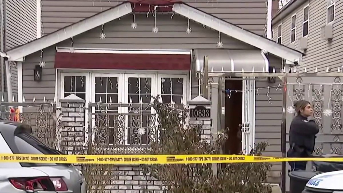 Police were called to the residence on 157th Street after a family member reportedly walked in and found the bloody scene.