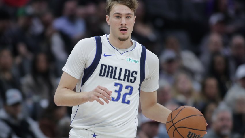 Dallas Mavericks forward Cooper Flagg dribbles the ball up court during the first half of an NBA basketball game against the Sacramento Kings, Tuesday, Jan. 6, 2026, in Sacramento, Calif. (AP Photo/Scott Marshall)