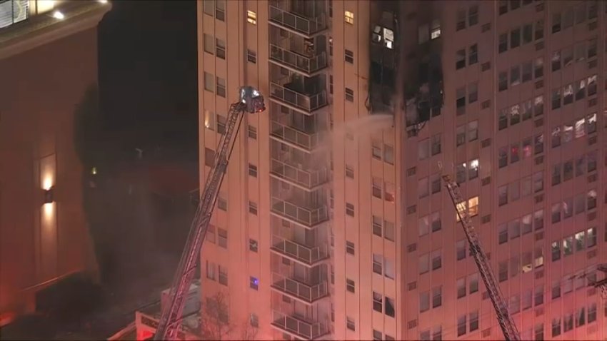 Fire crews put water on a fire at the Brighton Towers Condos in Atlantic City, New Jersey on Wednesday morning.