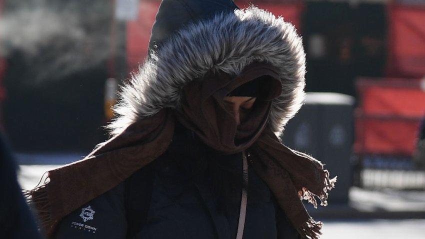 People walk through the freezing cold in the Brooklyn borough of New York on January 31, 2019. – A brutal cold wave moved eastward Thursday after bringing temperatures in the US Midwest lower than those in Antarctica, grounding flights, closing schools and businesses and raising fears of hypothermia. The extreme weather has now been blamed for as many as eight deaths, US news outlets reported. (Photo by Angela Weiss / AFP)        (Photo credit should read ANGELA WEISS/AFP via Getty Images)