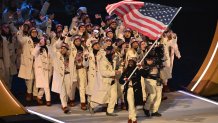 USA's flag bearer Erin Jackson parades with other athletes during the opening ceremony of the Milano Cortina 2026 Winter Olympic Games at the San Siro stadium in Milan, northern Italy, on Feb. 6, 2026.