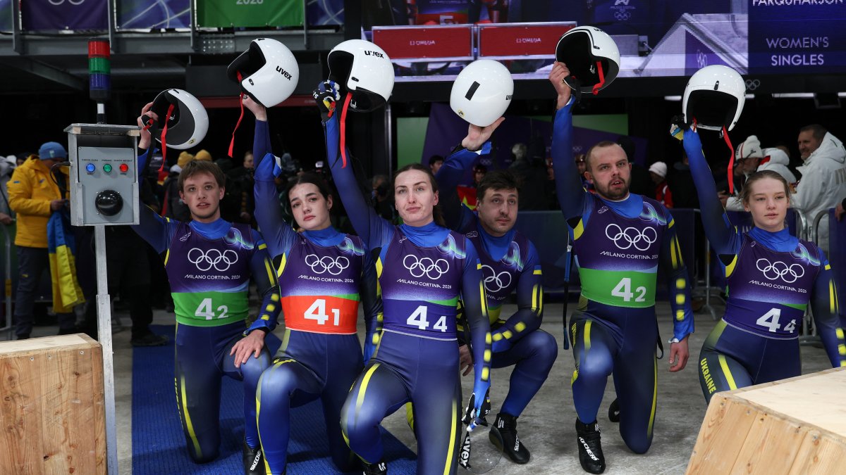 Ukraine luge team kneels in protest after teammate disqualified for helmet