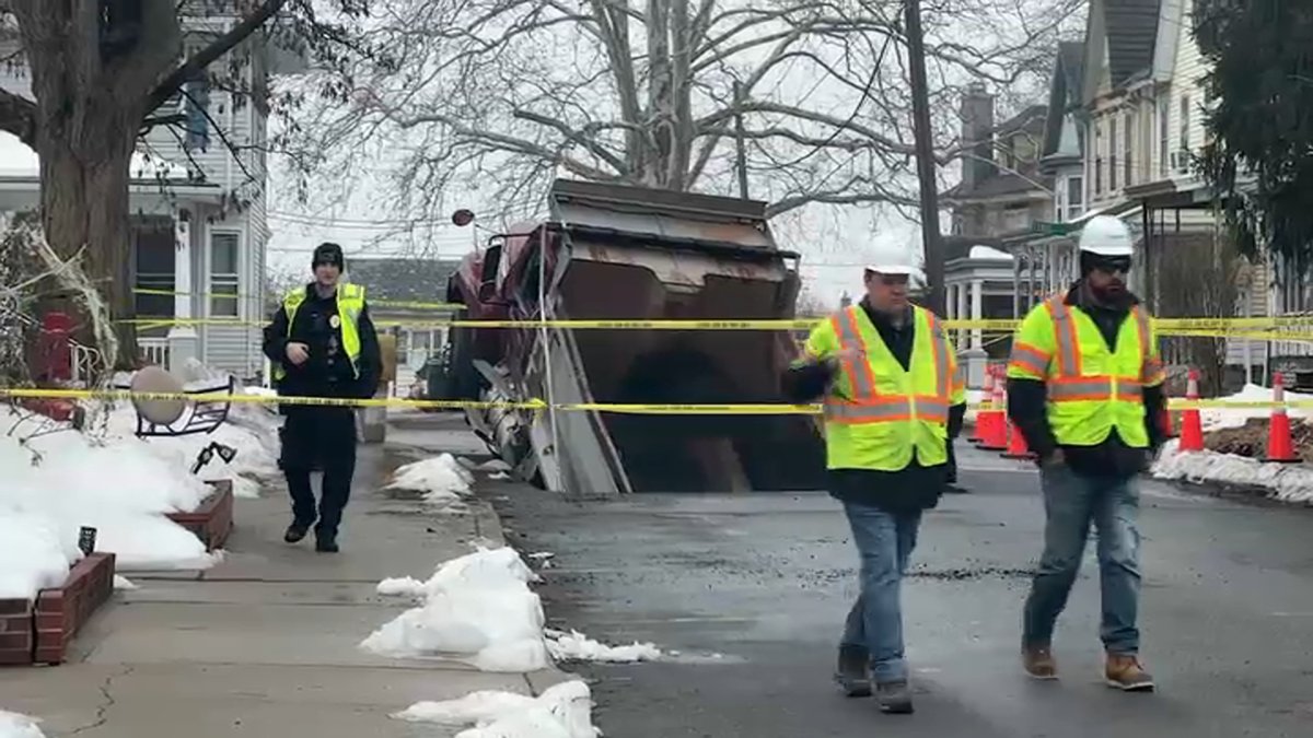 Sinkholes open up in New Jersey town, swallow dump truck
